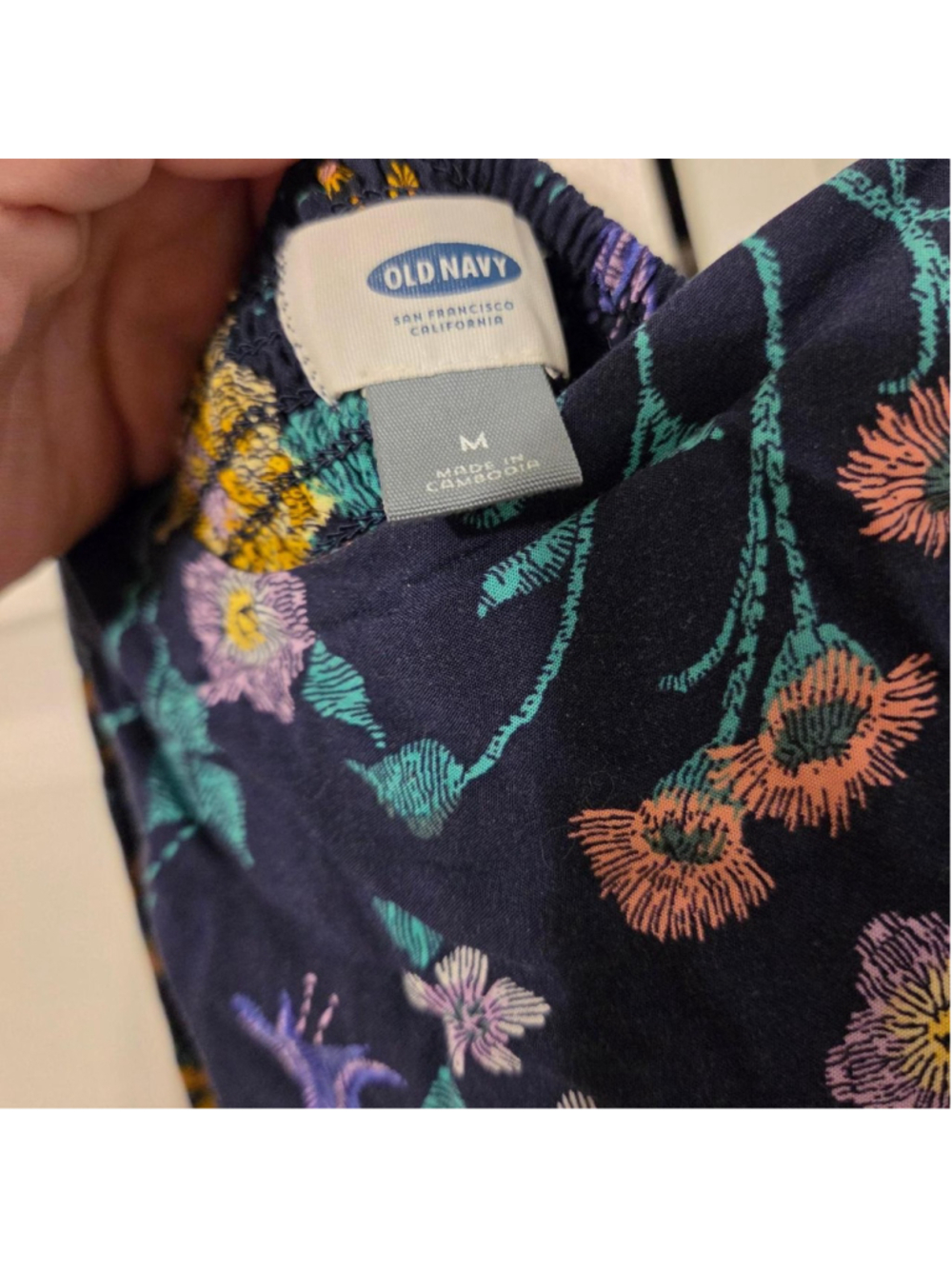 Old Navy floral mini dress with yellow, pink, and purple flowers on a dark backg - Picture 2 of 3